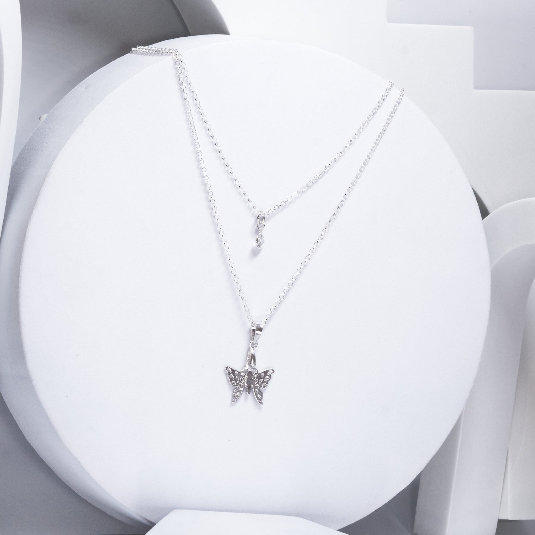 Collar doble cadena Mariposa con punto de Luz